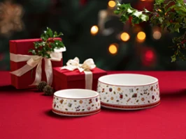 Matching pet bowls from the Toys Delight series by Villeroy & Boch, ideal for cats and dogs, combining functional design with festive elegance in white porcelain.