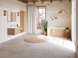 Une baignoire Subway 3.0 dans une salle de bains aux murs blancs et au sol en béton clair.