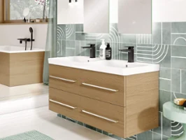 An Avento vanity unit in the colour Kansas Oak in a bathroom with green wall tiles