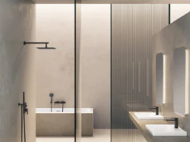 A minimalist bathroom with a walk-in shower, a freestanding bath, three washbasins with mirrors and modern taps. The design features neutral colours and clear lines.