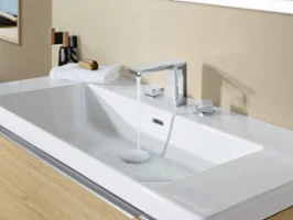 A Subway 3.0 washbasin tap on a white washbasin with running water
