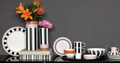 La Boule Memphis with graphic patterns in black, white, and orange. Featuring graphic patterns in black, white, and orange, La Boule Memphis combines artistic design with functional elegance and stylish accents.