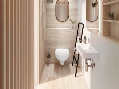 Et moderne gjestebad med trepaneler, et hvitt veggmontert toalett og en liten servant fra Villeroy & Boch.