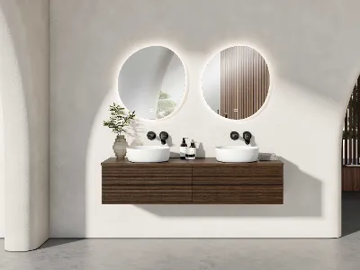 Modern bathroom with two round mirrors above two white Antao washbasins from Villeroy & Boch. Modern bathroom with two round mirrors above two white Antao washbasins from Villeroy & Boch on a wooden washstand. Black taps and minimalist decor complement the design.