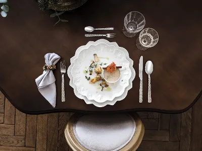 Elegant table decoration with gourmet food on Toy's Delight Royal Classic plates, ready for a fine dinner.