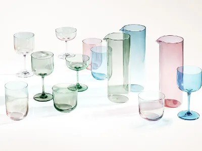 Like Drinkware in an array of colors Translucent colored drinking vessels, such as jugs and goblets, are displayed on a white surface.