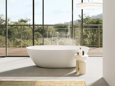 A white Antao bath in a room with a glass wall and trees.