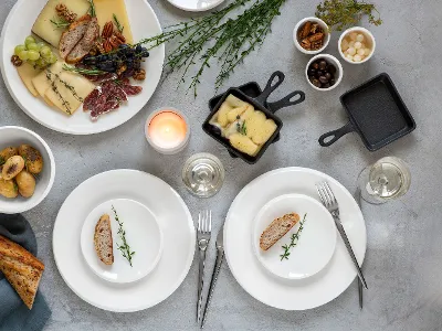 Villeroy & Boch white NewMoon plates at a raclette meal.