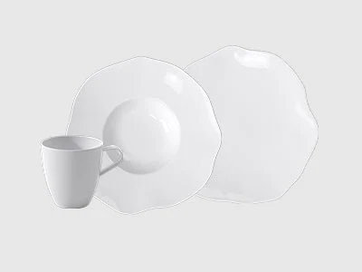 An arrangement of two plates and a cup, pura, presented on a light background.