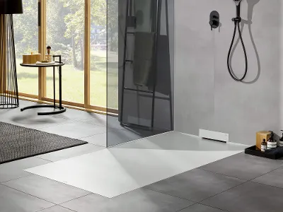 A modern bathroom with an innovative Wallway shower tray and a large window.