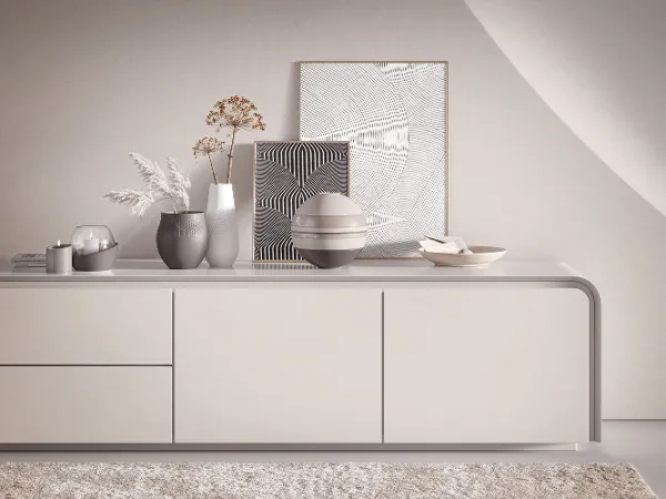 A white sideboard with Villeroy & Boch decorative Manufacture vases, NewMoon decoration and La Boule.