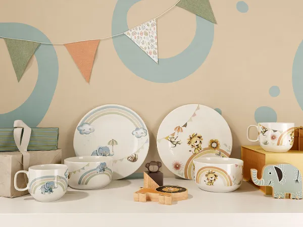 Boho Kids complete children's crockery sets as gifts with bunting in the background and a wooden toy.