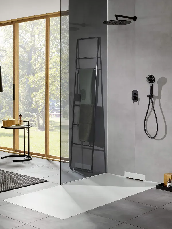 A modern bathroom with an innovative Wallway shower tray and a large window.