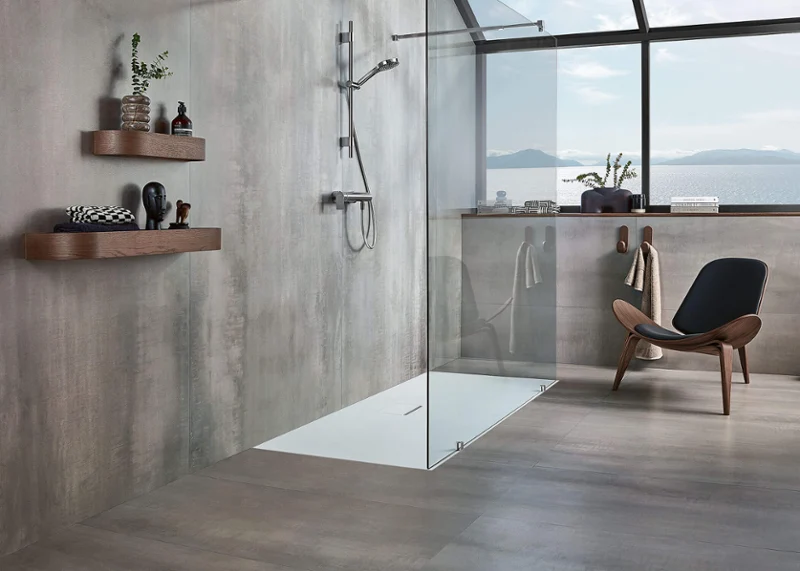 Squaro Infinity shower tray with a brown chair A modern grey bathroom with a Squaro Infinity shower tray and a brown chair.