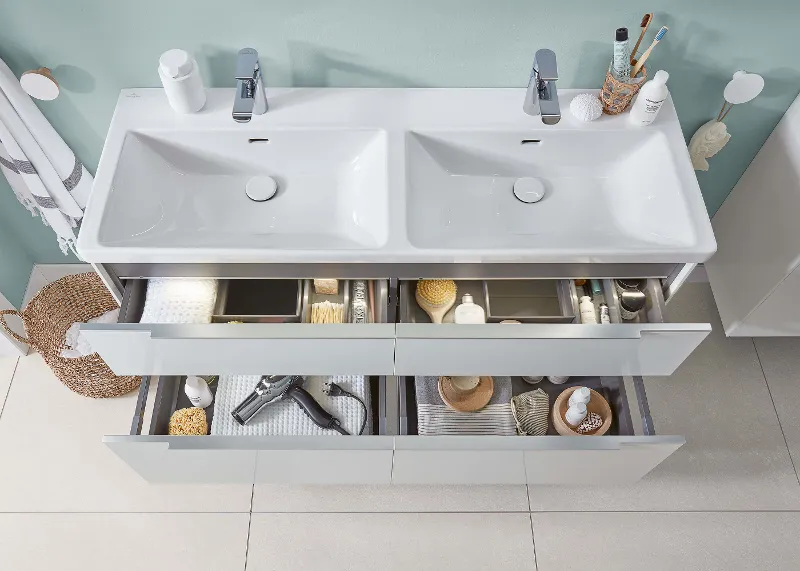 A white double washbasin on a Subway 3.0 vanity unit with two open drawers.