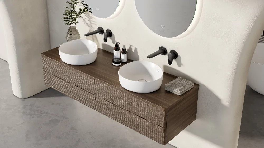 A modern bathroom with two washbasins and black taps from the Antao collection by Villeroy & Boch.