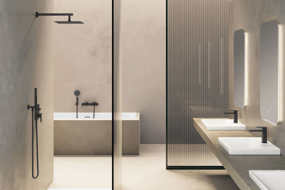 Universal Shower shower tap A black shower head attached to a shower rail on a grey tiled wall.