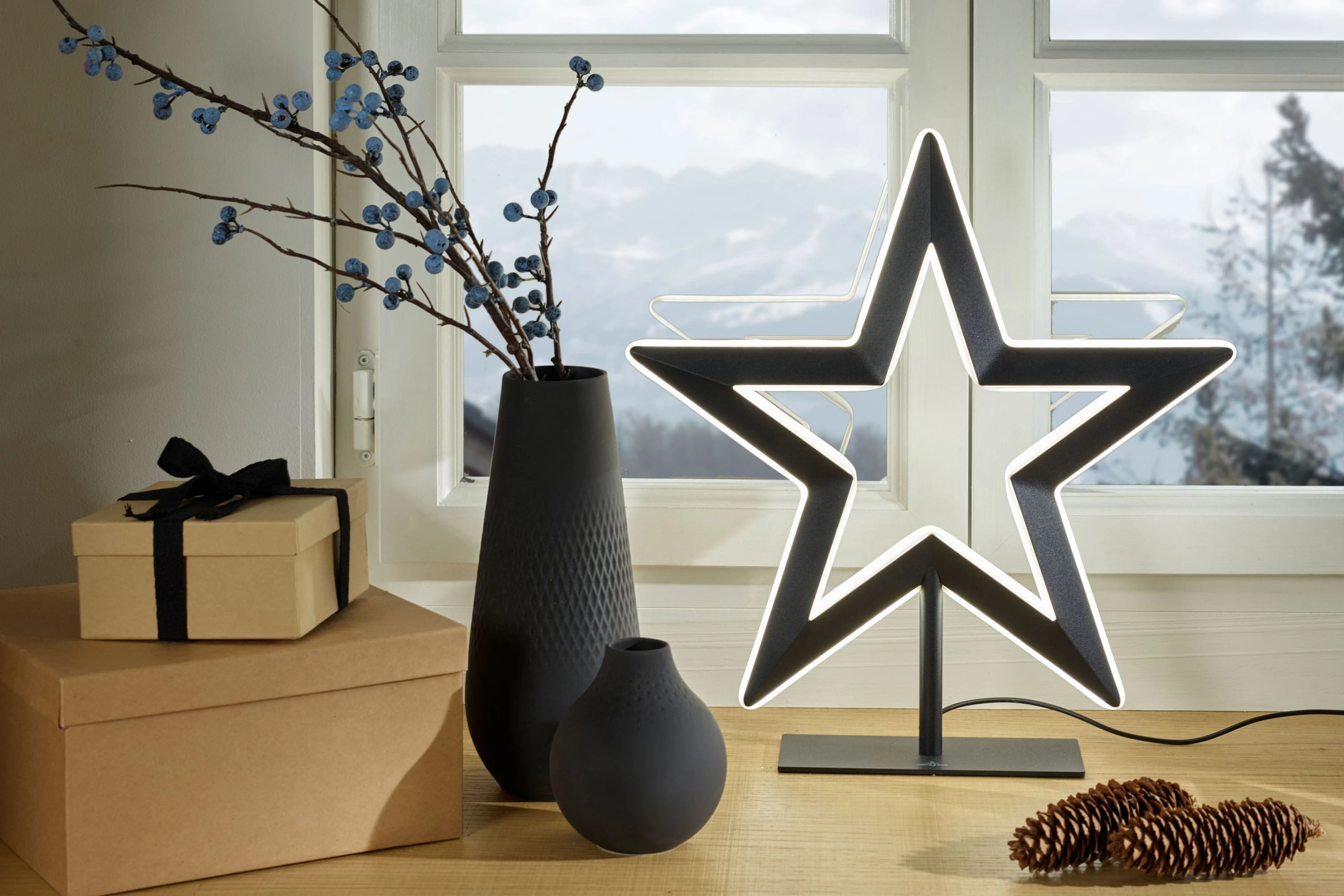 Manufacture Noir Collier Vases and Perle Collection for Christmas A festive arrangement of Manufacture Noir Collier and Perle vases decorated for a modern Christmas table.