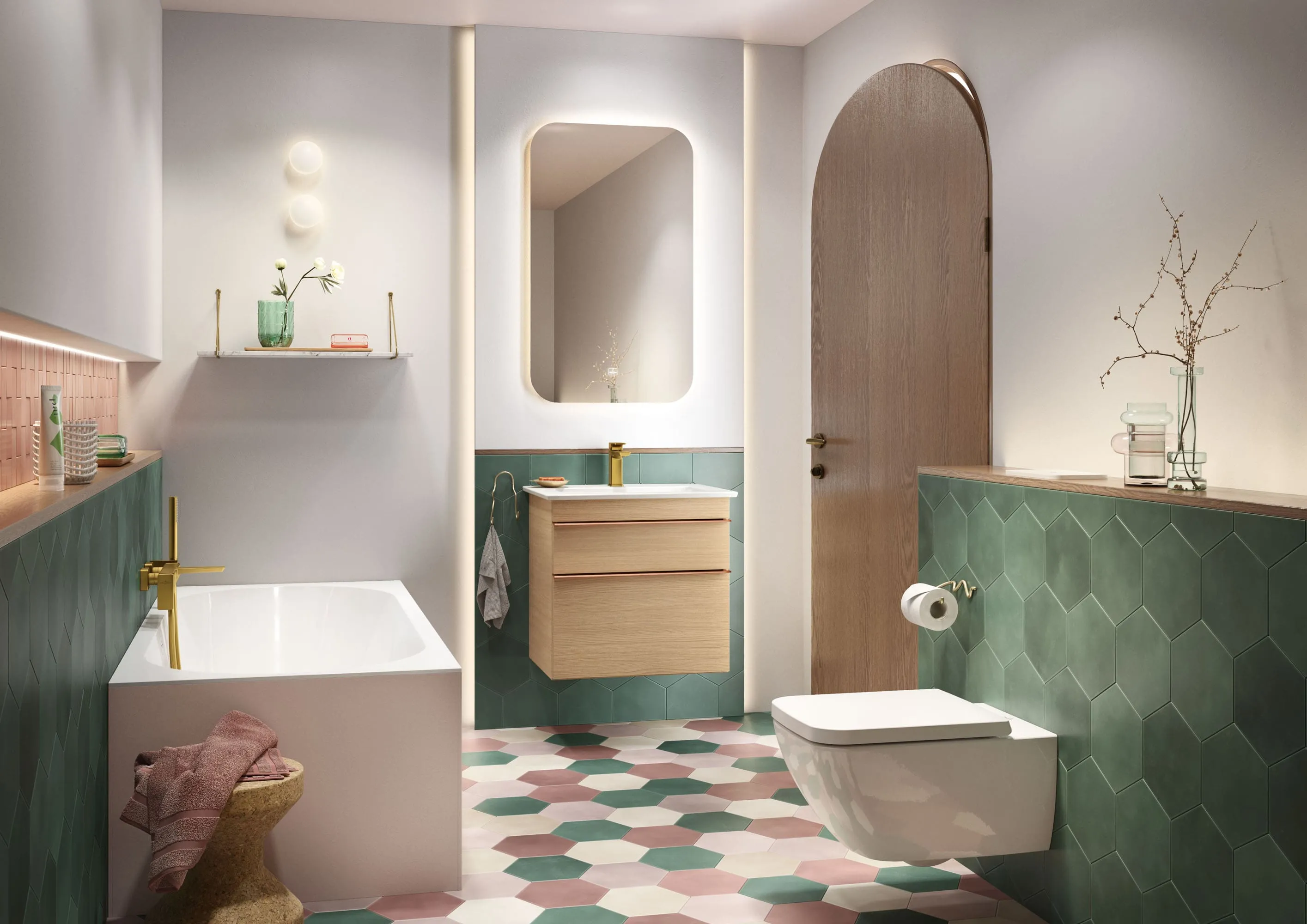 Venticello Bad mit Badewanne, Waschbecken und Toilette Ein modernes Badezimmer mit Badewanne, Wand- Waschbecken mit Spiegel und wandmontierter Toilette. Der Raum ist mit sechseckigen Bodenfliesen in den Farben Grün, Rosa und Weiß ausgestattet.