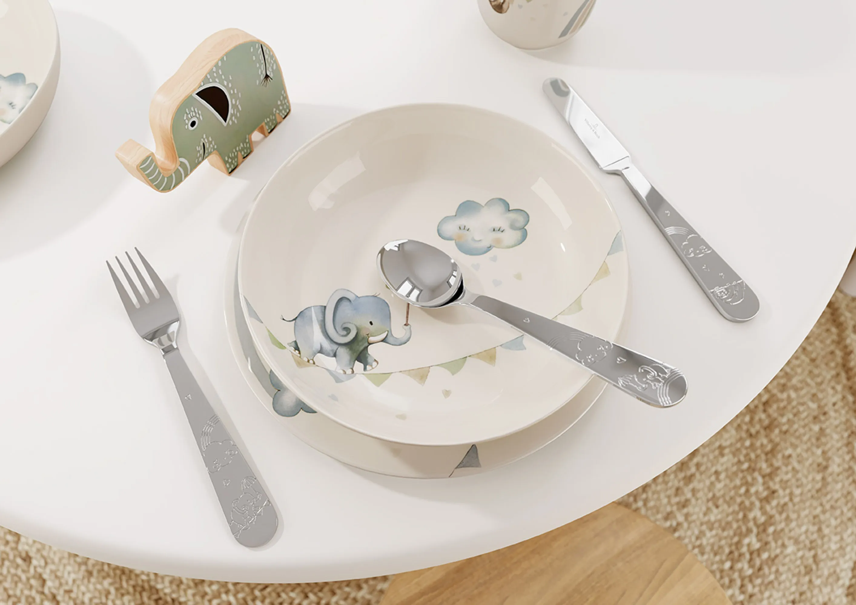 Boho Kids Walk like an Elephant children's crockery set with an elephant pattern on a white table.