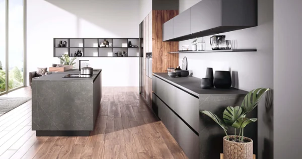 Finera Square kitchen tap on grey kitchen island A Finera Square kitchen tap on a grey kitchen island in a bright kitchen with grey kitchen units