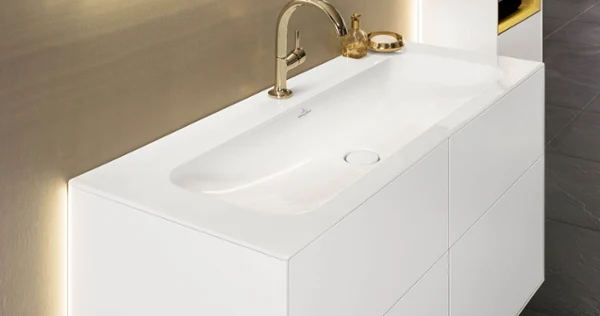 White Finion vanity washbasin with base unit and lighting.