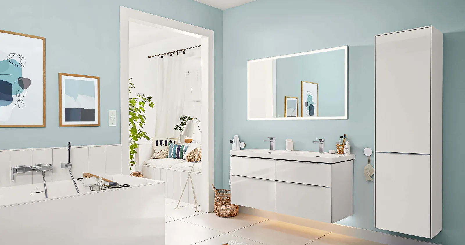 A white bathroom with blue walls and a flat illuminated Subway 3.0 mirror and coordinating bathroom furniture.