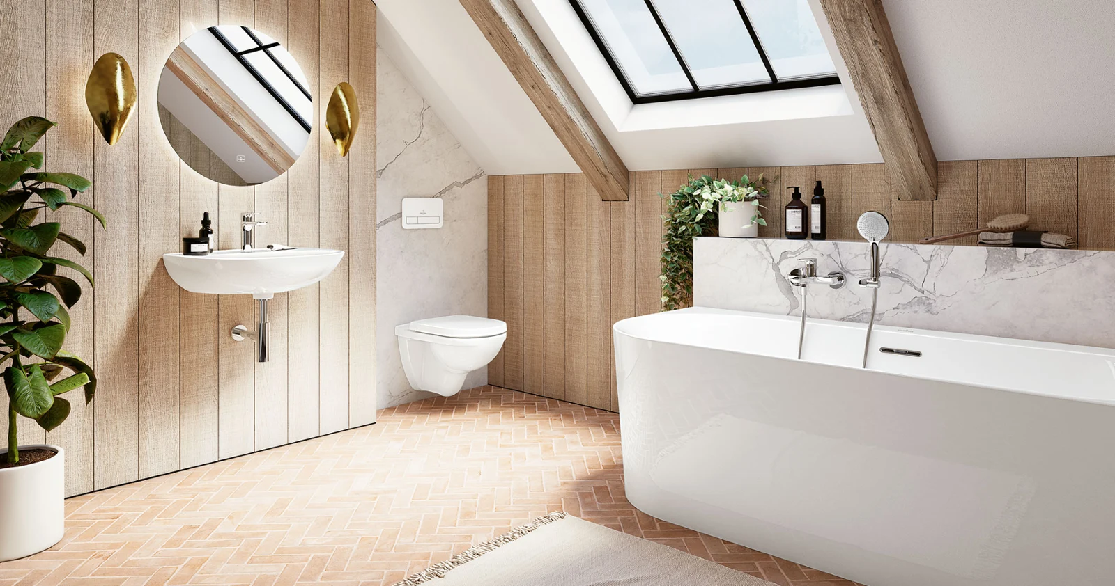 Bañera O.novo con lavabo e inodoro. Un cuarto de baño moderno con bañera, lavabo mural, espejo redondo e inodoro de la colección O.novo. Una gran claraboya y una maceta realzan la estancia. Los detalles de madera y las baldosas en espiga dan a la habitación un toque rústico.