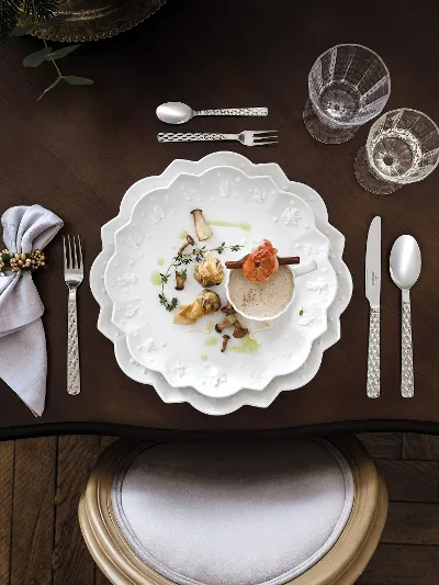 Elegant table decoration with gourmet food on Toy's Delight Royal Classic plates, ready for a fine dinner.