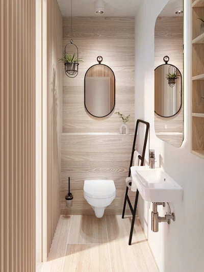 Et moderne gjestebad med trepaneler, et hvitt veggmontert toalett og en liten servant fra Villeroy & Boch.