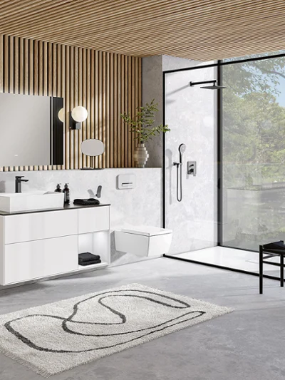 A modern bathroom with modern wooden ceilings and a white Memento 2.0 washbasin and toilet.