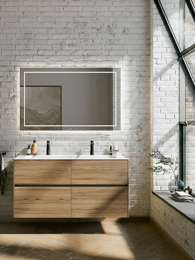 Brown Finion double washbasin with an illuminated mirror Modern bathroom with a floating Finion wooden washstand, a large illuminated mirror, brick walls and large windows. It has a black stool and decorations on the shelf and along the windowsill.