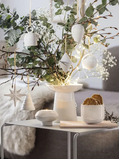 A living room decorated with Villeroy & Boch Winter Glow ornaments.