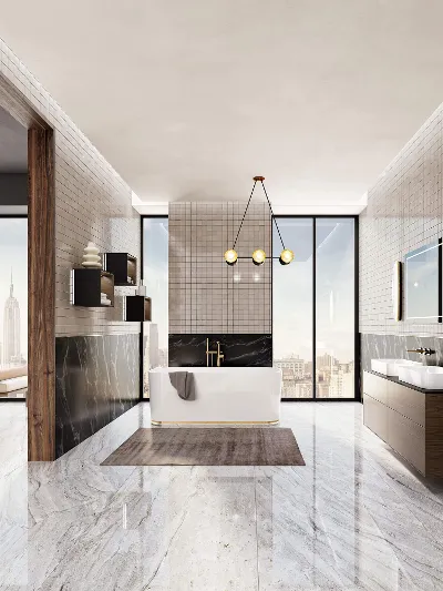 A freestanding bath from the Finion collection in a modern brightly lit bathroom.