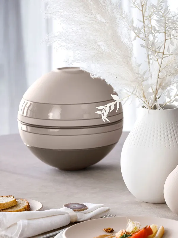 A table set with a Villeroy & Boch La Boule Beige and Manufacture vases.