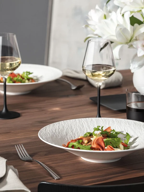 Manufacture Rock Blanc Table Set with Carré Vase A contemporary Manufacture Rock Blanc tableware set paired with a matching Carré vase with flowers for a clean, modern table setting.