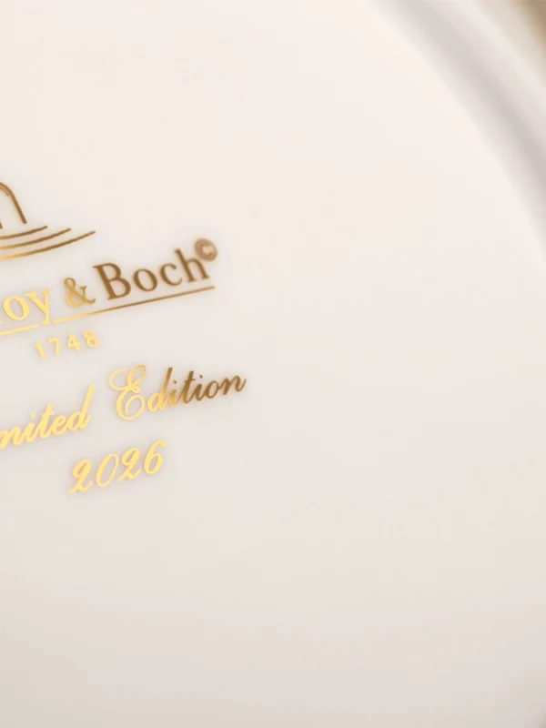 Close-up of a Villeroy & Boch porcelain piece showing "Laurel Edition 2012" in gold lettering on the bottom.