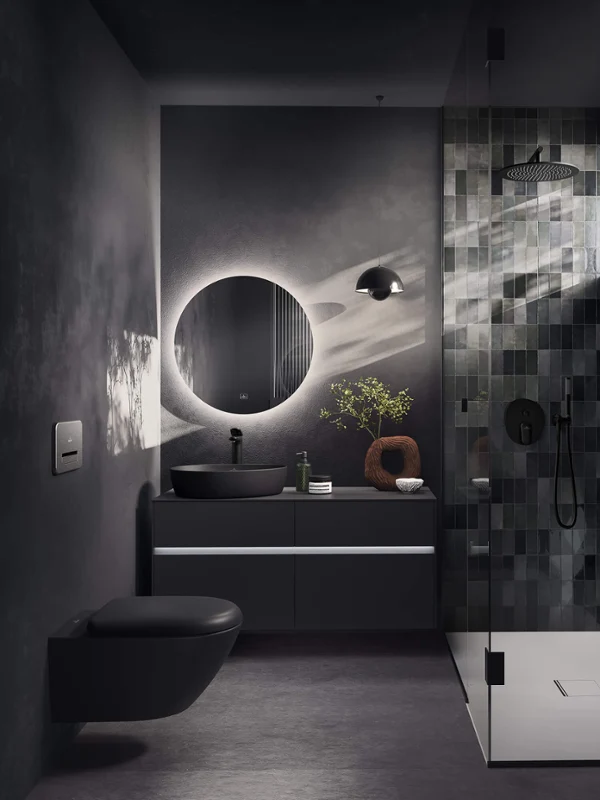 Small Black Bathroom with Antao Countertop Basin: Small black bathroom with Antao countertop basin Modern bathroom with dark tiles, a round mirror, a floating sink and a glazed shower with natural light.