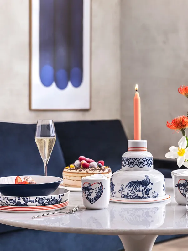 A table set with a Villeroy & Boch blue-and-white La Boule and the Jubilee Birthday Cake.