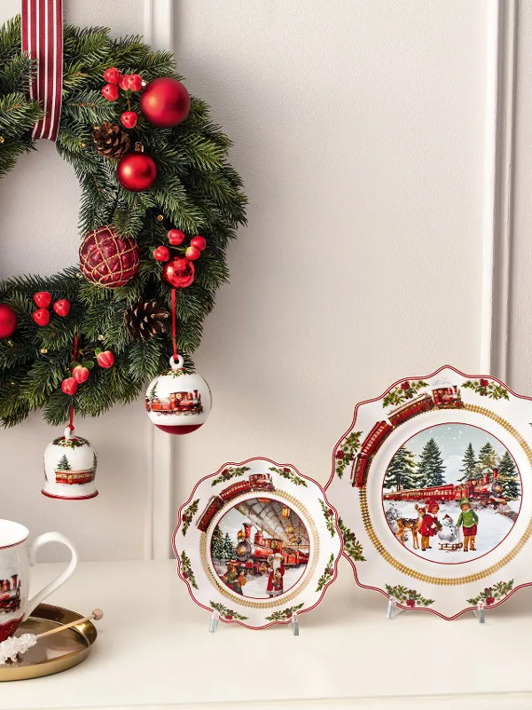 Festive Villeroy & Boch Annual Christmas Edition 2025 with decorated porcelain on a white sideboard.
