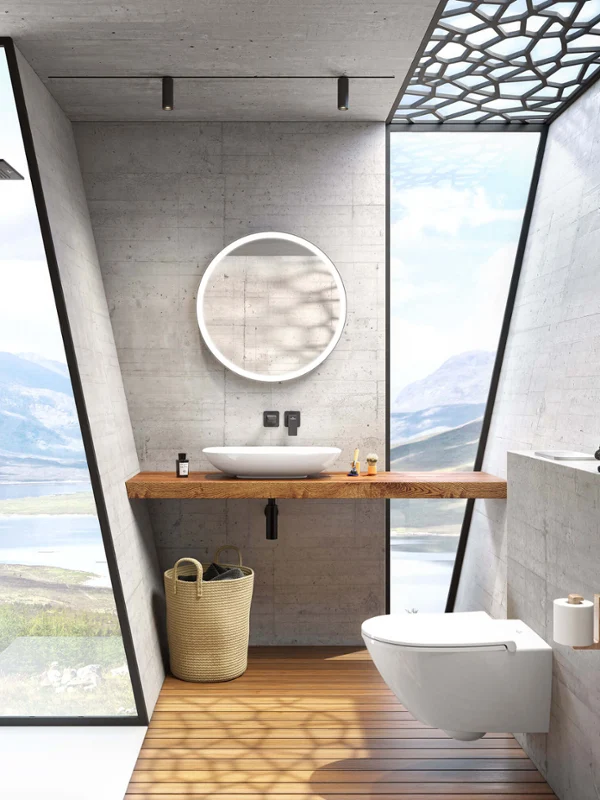 Subway 3.0 mirror with a white Loop & Friends surface-mounted washbasin Modern bathroom with concrete walls, a large window with a view of a lake, a round Subway 3.0 mirror and a white Loop & Friends surface-mounted washbasin
