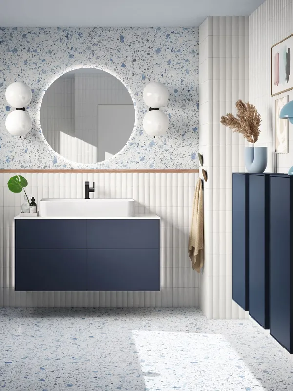 Finion Midnight Blue Matt vanity unit and wall cabinet in a modern bathroom with light-blue accents by Villeroy & Boch.