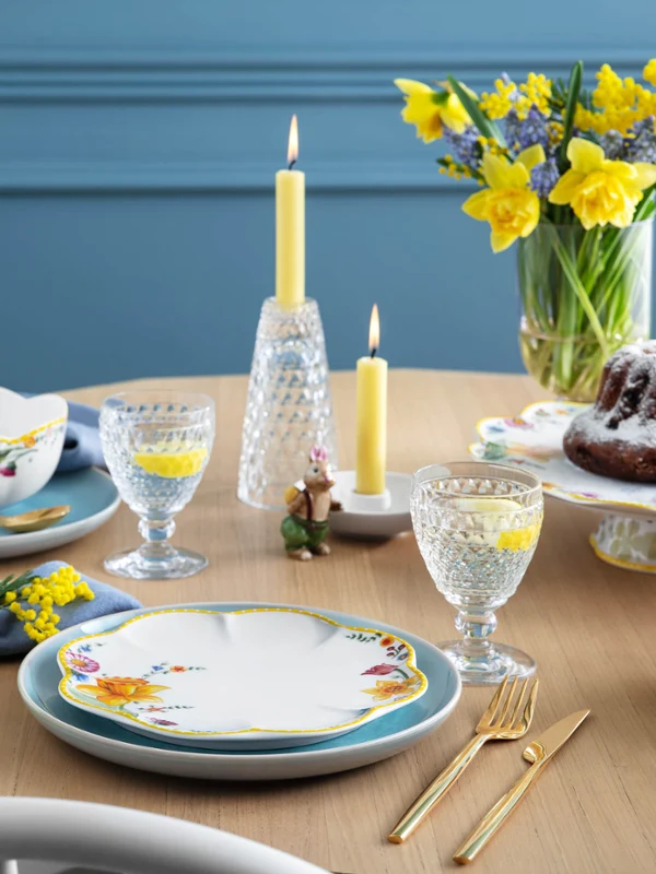 A beautifully laid table with the Spring Awakening, Crafted and Boston collections together with yellow daffodils and a Bundt cake, ready for a festive meal.