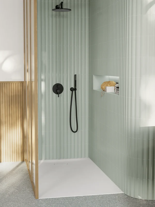 Villeroy & Boch Ecora shower tray fitted flush with the floor in a sage-green shower with black fittings and a wood-slat divider.