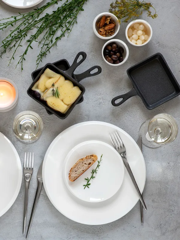 Villeroy & Boch white NewMoon plates at a raclette meal.