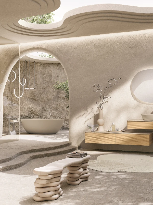 Bagno wellness Antao in beige con vasca freestanding Bagno Antao in tonalità beige, con vasca autoportante, lavabo sospeso e design scultoreo illuminato dalla luce naturale