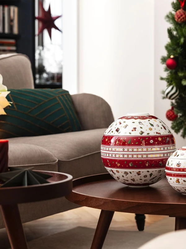 A living room decorated for Christmas with the Toy’s Delight La Boule and the Toy’s Delight La petite Boule on a wooden coffee table.