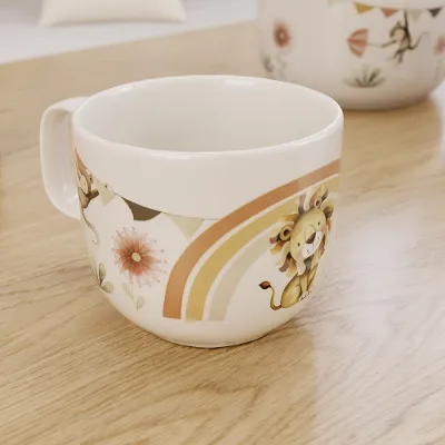 Decorative ceramic cup with the floral and animal Boho Kids Roar like a Lion pattern on a wooden surface