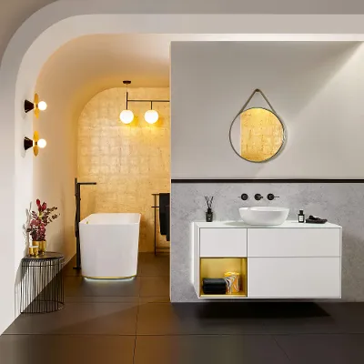 White Artis surface-mounted washbasin with a Conum tap and Finion bath and furniture.