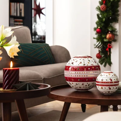 Toy's Delight La Boule and Toy's Delight La petite Boule on a wooden coffee table. A festively decorated living room with the Toy's Delight La Boule and the Toy's Delight La petite Boule on a wooden coffee table.